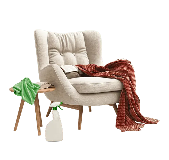 An upholstered armchair with a throw over one arm, a cloth and a spray bottle beside it